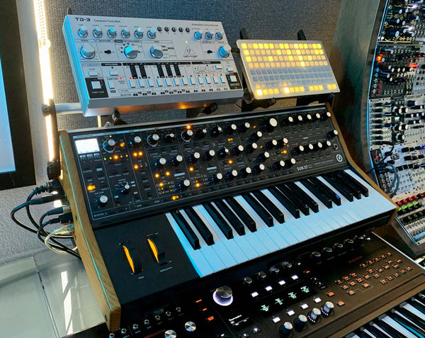 KVgear SubPiggy stand holding Behringer TD-3 and monome controller on a Sub37 synth