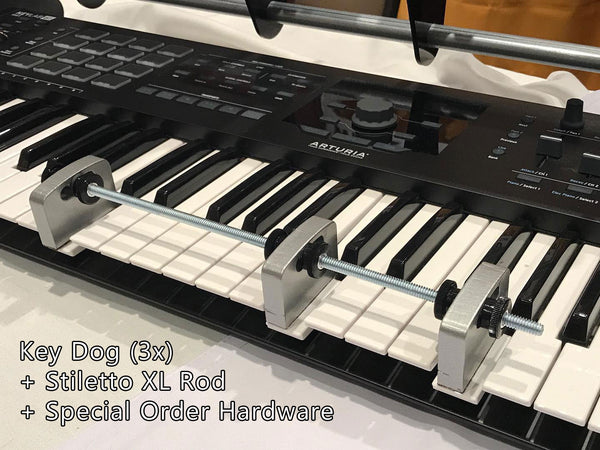 Three Key Dogs holding a chord on a synth keyboard.