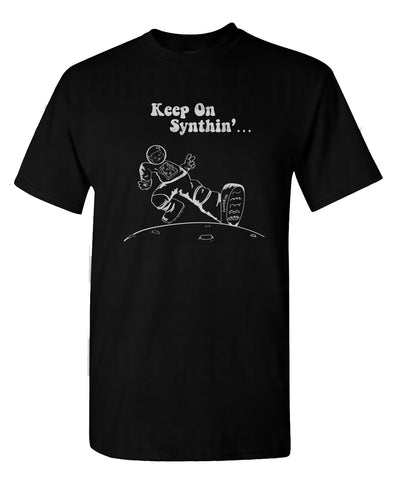 T-shirt with "Keep On Synthin'" and a cat astronaut strutting on the moon.