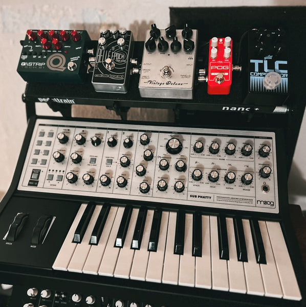 SubPiggy stand mounted to Moog Sub Phatty synth with fx pedals above.