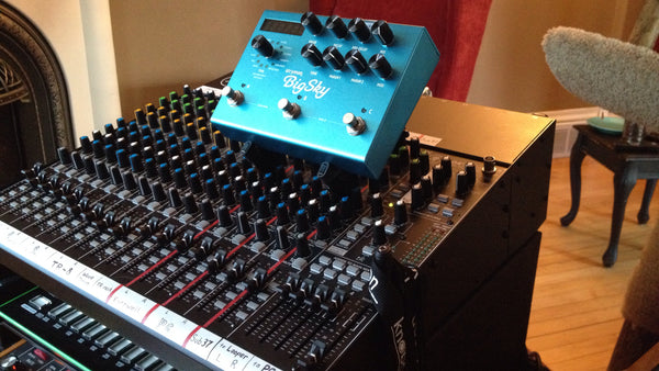 KVgear Stiletto Angled stand holds Strymon BigSky effects pedal on a mixing board.